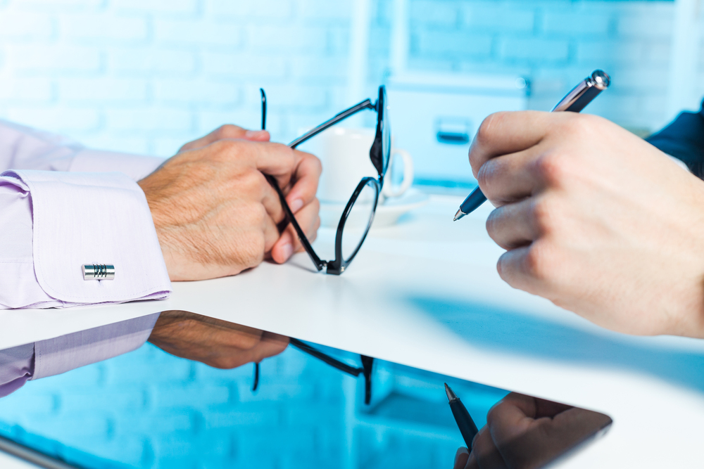 Optometrist accountant talking with optometrist Optometrist accountant talking with optometrist